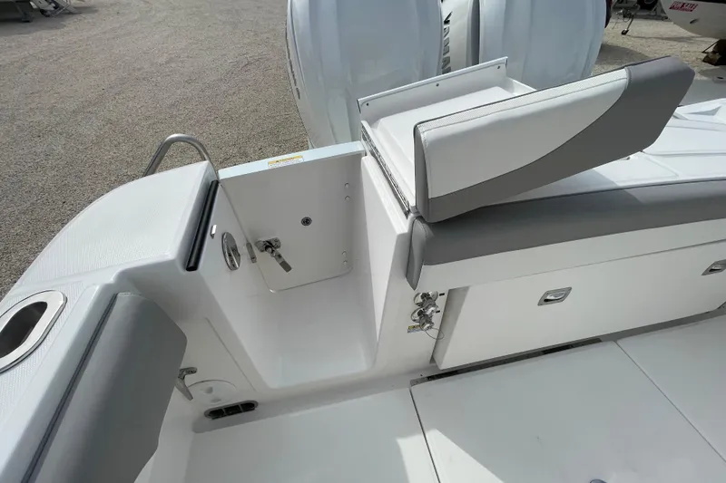 Slide: The Image of 2026 Regulator 25 boat interior with seating and storage compartments. - 28