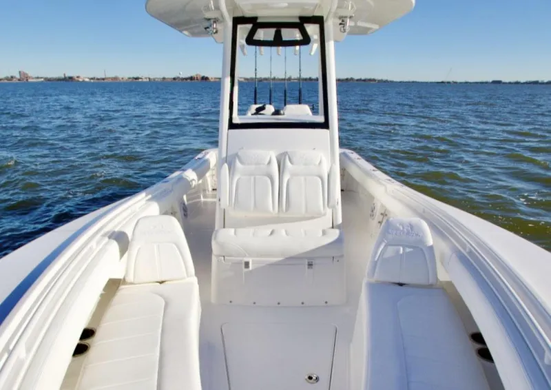 Slide: The Image of 2026 Regulator 25 boat storage compartment open, showcasing spacious interior design. - 4