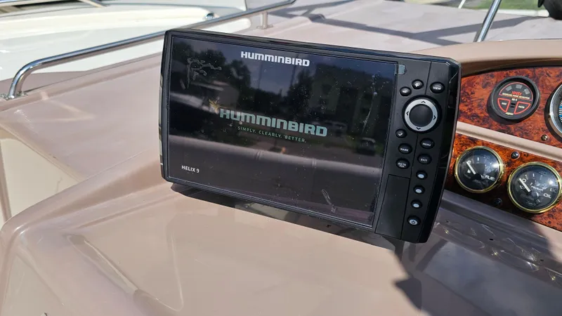 Slide: The Image of Humminbird Helix 9 fish finder on 2003 Regal Commodore 3260 boat dashboard. - 13
