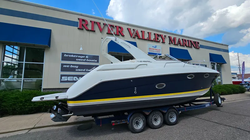 Slide: The Image of 2003 Regal Commodore 3260 boat on trailer at River Valley Marine dealership. - 2