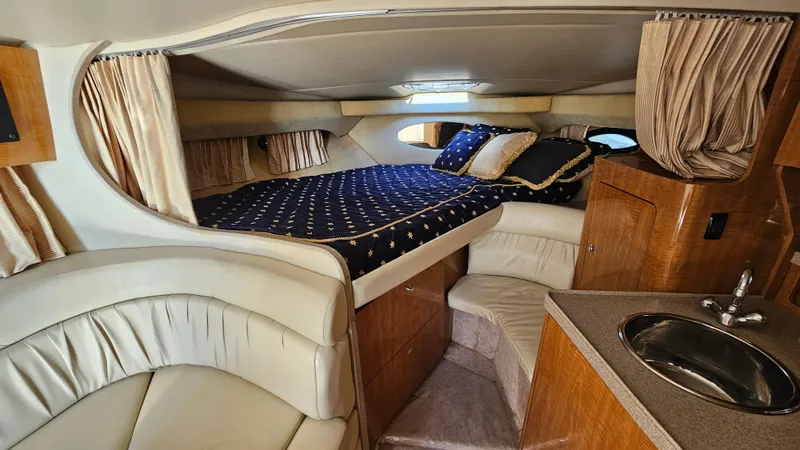 Slide: The Image of Luxurious cabin interior of 2003 Regal Commodore 3260 yacht with cozy bed and sink. - 21