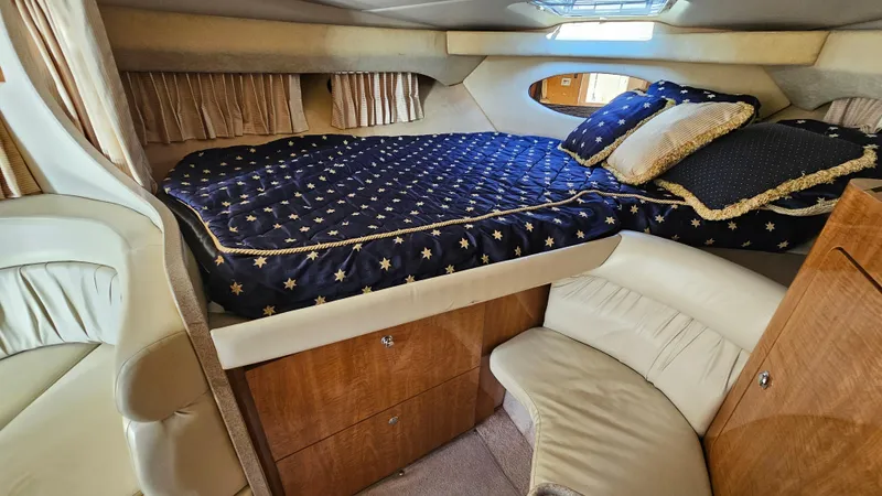 Slide: The Image of Luxurious cabin interior of 2003 Regal Commodore 3260 yacht with star-patterned bedding. - 22