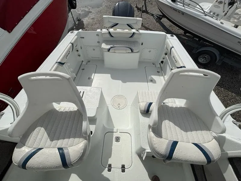 Slide: The Image of 2005 Polar 2300 Walkaround cabin interior with sink, storage, and mini fridge. - 16