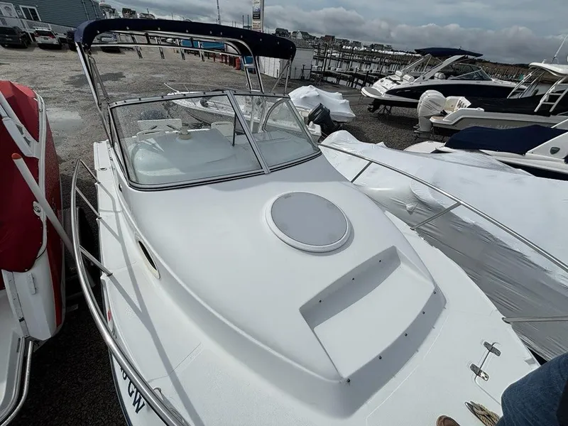 Slide: The Image of 2005 Polar 2300 Walkaround boat with Yamaha engine, parked on gravel. - 8