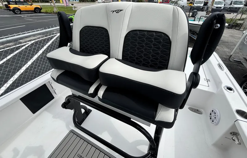 Slide: The Image of 2026 Tidewater 2210 Carolina Bay boat seats with black and white upholstery. - 12