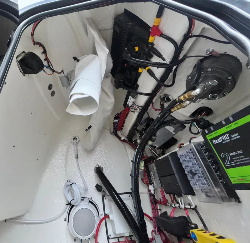Slide: The Image of Interior view of 2026 Tidewater 2210 Carolina Bay boat's wiring and battery system. - 17