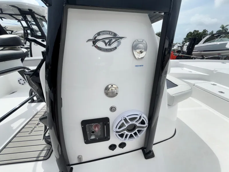 Slide: The Image of 2026 Tidewater 2210 Carolina Bay boat console with speaker and controls. - 18