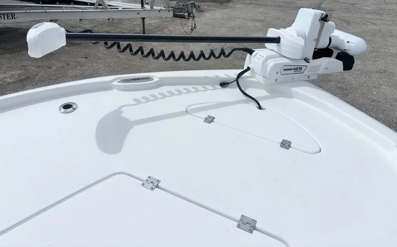 Slide: The Image of 2026 Tidewater 2210 Carolina Bay boat with Minn Kota trolling motor on deck. - 22
