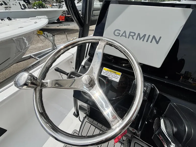 Slide: The Image of Steering wheel of 2026 Tidewater 2210 Carolina Bay boat with Garmin display. - 23