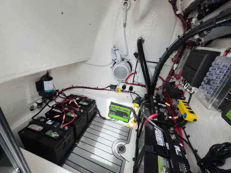 Slide: The Image of Electrical system of 2026 Tidewater 2210 Carolina Bay boat, featuring batteries and wiring. - 25