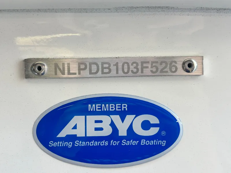 Slide: The Image of 2026 Tidewater 2210 Carolina Bay boat with ABYC membership plaque and serial number. - 32