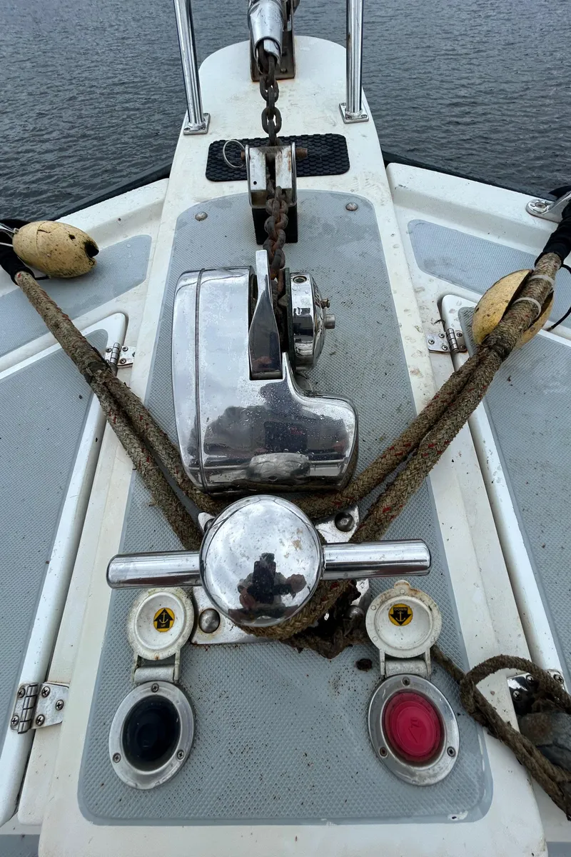Slide: The Image of Anchor winch on 1998 Monk 36 boat deck with ropes and controls. - 12