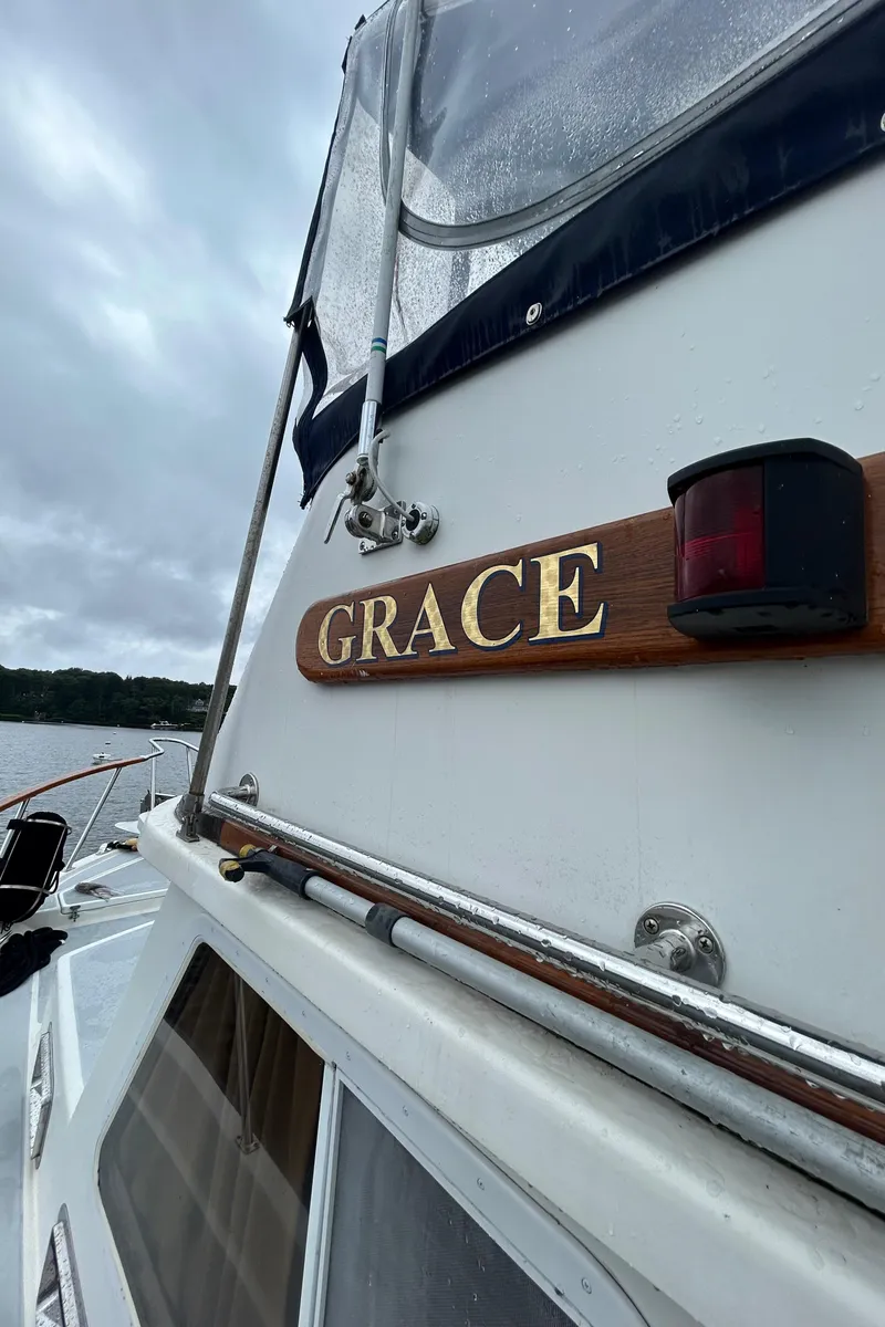 Slide: The Image of Monk 36 boat named "Grace" on a cloudy day, 1998 model. - 23