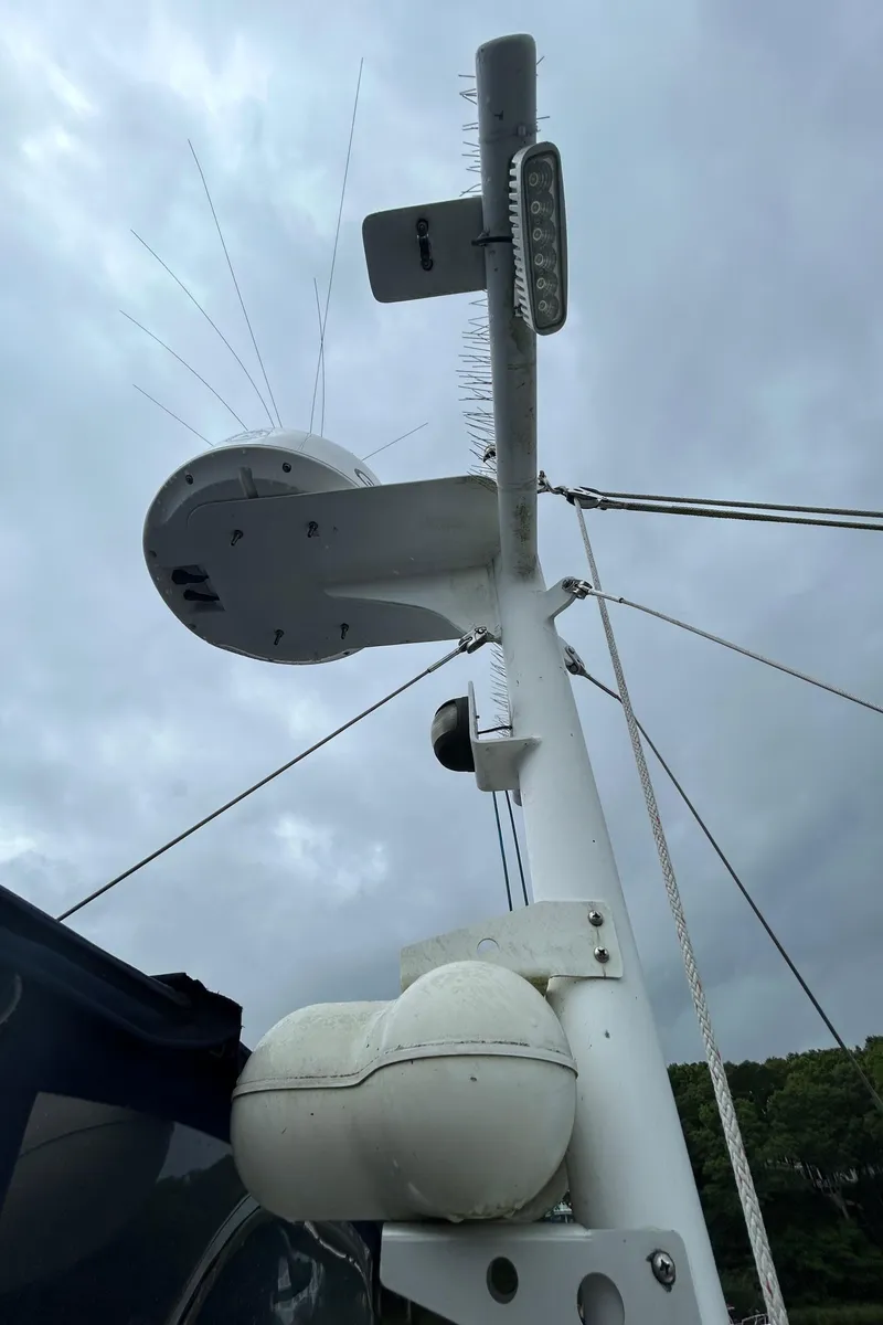 Slide: The Image of Mast of 1998 Monk 36 boat with radar and antennas against cloudy sky. - 34