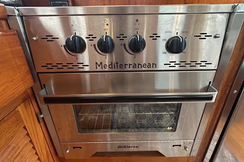 Slide: The Image of Stainless steel Mediterranean oven with control knobs, Dickinson brand, in a 1998 Monk 36 boat. - 48
