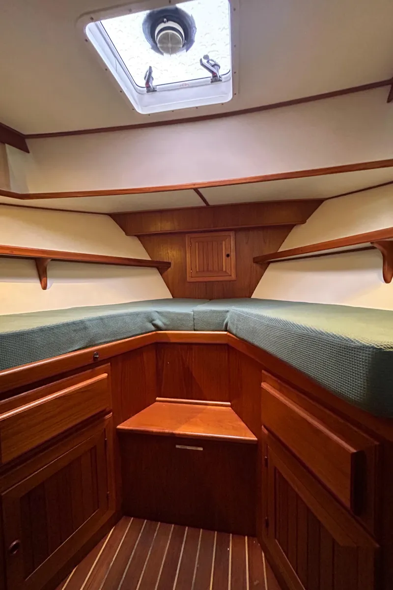 Slide: The Image of Cozy cabin interior of 1998 Monk 36 boat with wooden finish and overhead hatch. - 6