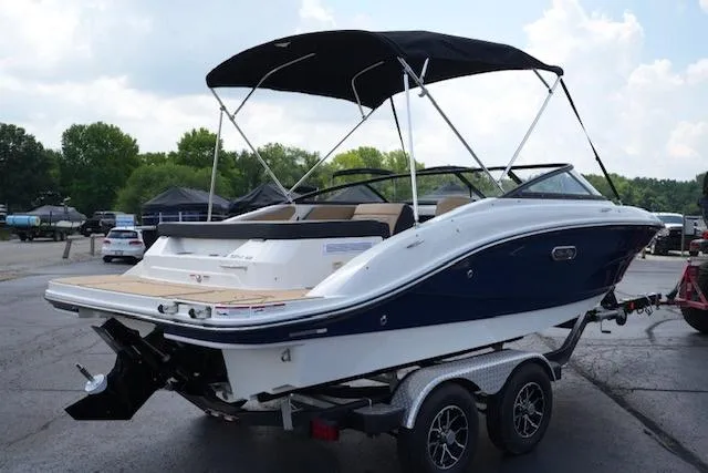 Slide: The Image of 2025 Sea Ray SPX 190 boat on trailer, featuring sleek design and black canopy. - 4