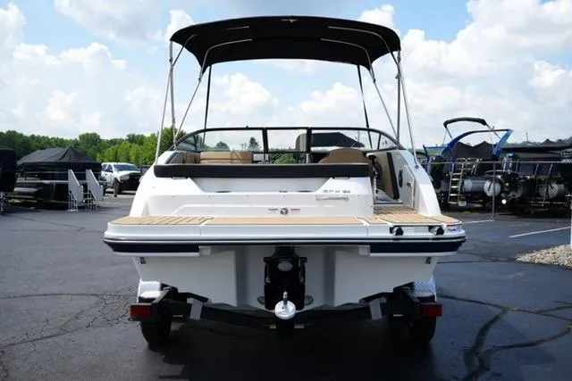 Slide: The Image of 2025 Sea Ray SPX 190 boat with canopy, rear view in a parking lot. - 5