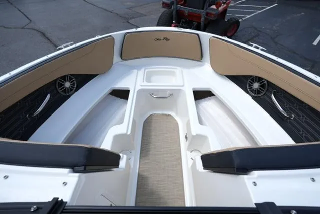 Slide: The Image of 2025 Sea Ray SPX 190 boat interior with tan seating and modern design. - 9