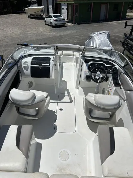 Slide: The Image of 2022 Sea-Doo 230 Challenger boat interior with seating and dashboard view. - 5