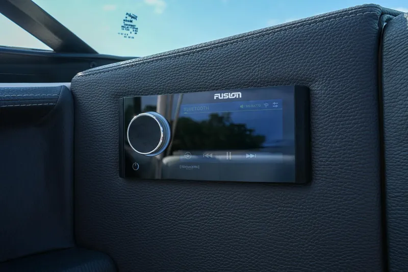 Slide: The Image of 2023 Regal 29 OBX boat featuring a Fusion Bluetooth audio system. - 16