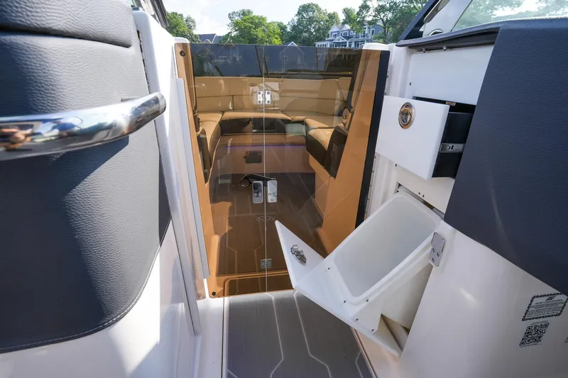 Slide: The Image of 2023 Regal 29 OBX boat interior with seating and storage compartments. - 17
