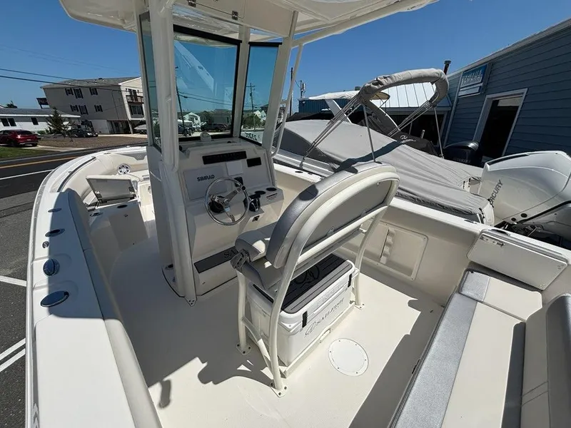 Slide: The Image of 2026 Sailfish 232 CC boat interior with helm, seating, and modern controls. - 13