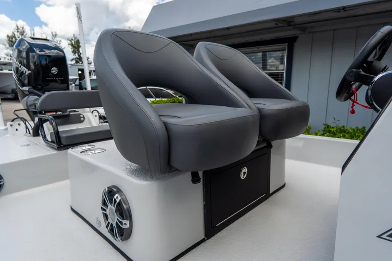 Slide: The Image of 2021 SCB S22 boat with dual gray seats and speaker system. - 16