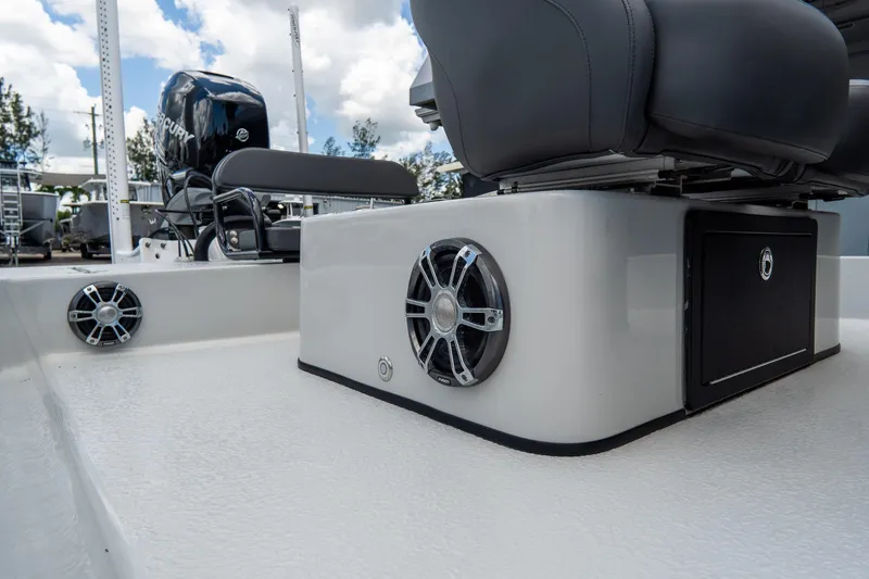 Slide: The Image of 2021 SCB S22 boat interior with speakers and seating, featuring a Mercury engine. - 17