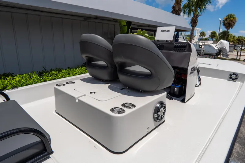 Slide: The Image of 2021 SCB S22 boat interior with dual seats and Simrad navigation system. - 18