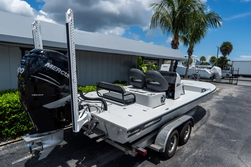 Slide: The Image of 2021 SCB S22 boat with Mercury Verado engine on trailer, parked outdoors. - 3