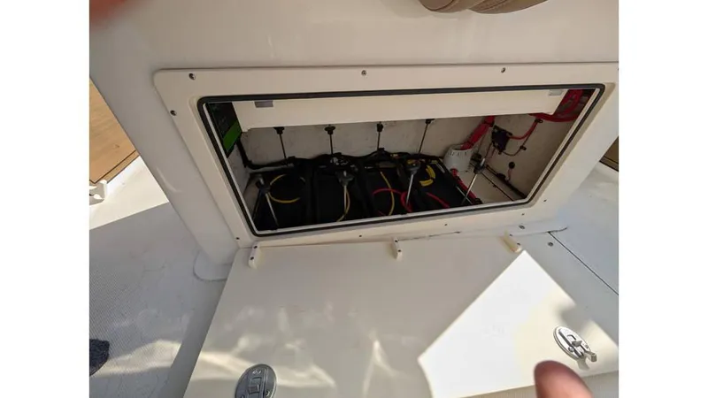 Slide: The Image of 2024 Sea Born LX22 Center Console battery compartment with wiring and connections. - 11