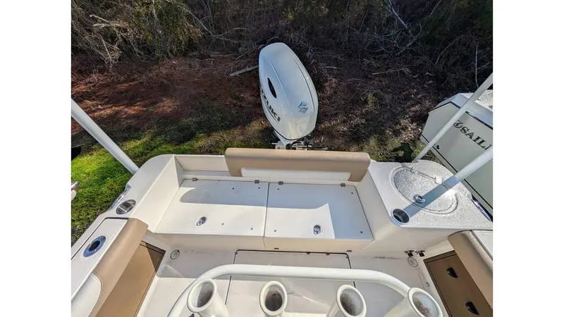 Slide: The Image of 2024 Sea Born LX22 Center Console boat interior with seating and storage compartments. - 2