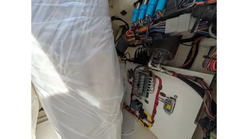 Slide: The Image of Electrical wiring and components inside a 2024 Sea Born LX22 Center Console boat. - 8