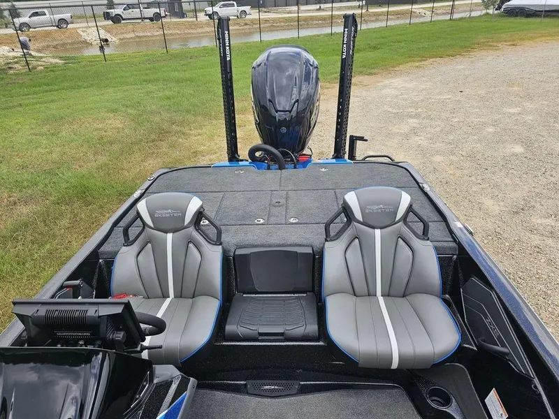 Slide: The Image of 2026 Skeeter ZXE20 boat interior with dual seats and modern dashboard. - 12