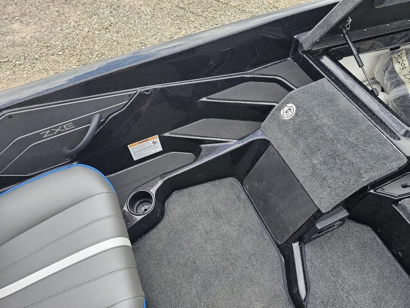 Slide: The Image of 2026 Skeeter ZXE20 boat interior with gray seating and storage compartments. - 14
