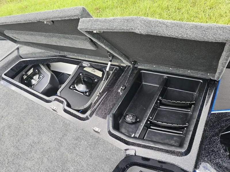 Slide: The Image of Open storage compartments on a 2026 Skeeter ZXE20 boat, showcasing interior design and functionality. - 16