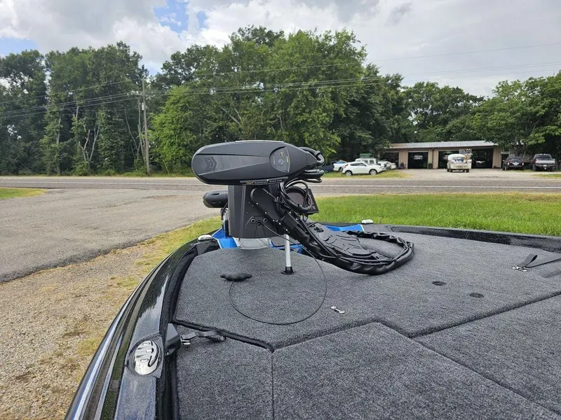 Slide: The Image of 2026 Skeeter ZXE20 boat with advanced trolling motor on a grassy roadside. - 18