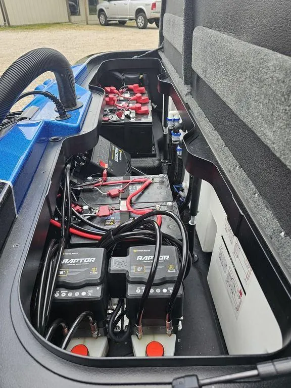 Slide: The Image of Battery compartment of 2026 Skeeter ZXE20 boat with wiring and components. - 19