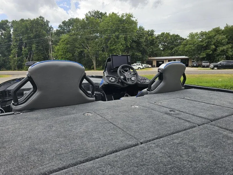 Slide: The Image of 2026 Skeeter ZXE20 boat interior with dual seats and steering console. - 20