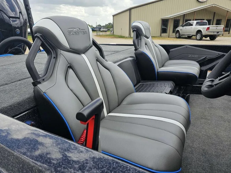 Slide: The Image of 2026 Skeeter ZXE20 boat interior with sleek gray and blue seats. - 7