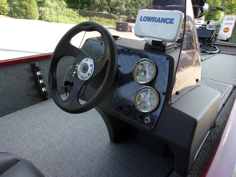 Slide: The Image of 2020 Bass Tracker 160 PRO boat dashboard with steering wheel and Lowrance fish finder. - 11