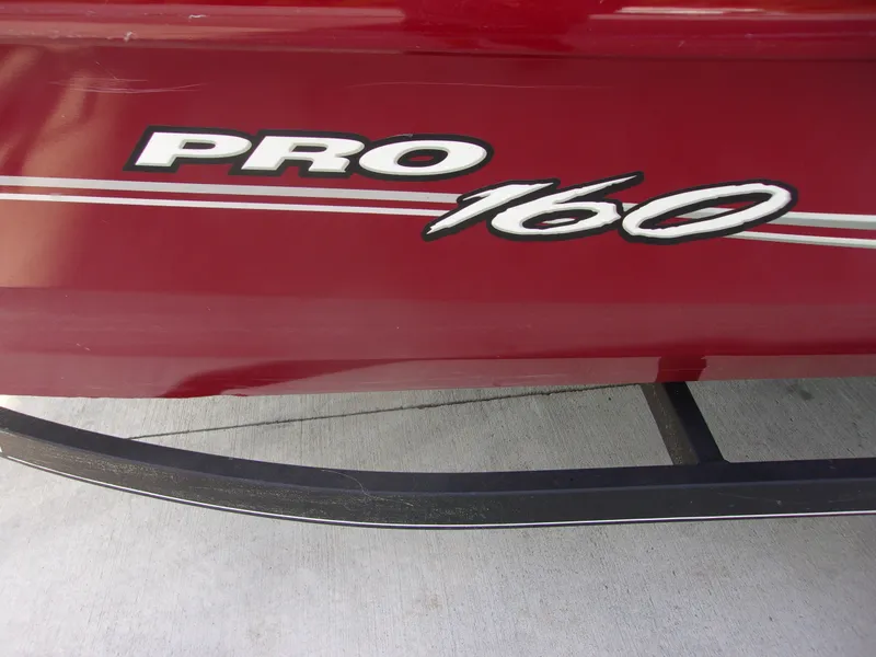 Slide: The Image of Red Bass Tracker 160 PRO boat, 2020 model, with bold white lettering. - 15