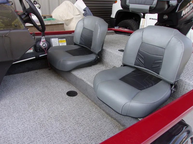 Slide: The Image of 2020 Bass Tracker 160 PRO boat interior with gray seats and steering wheel. - 3