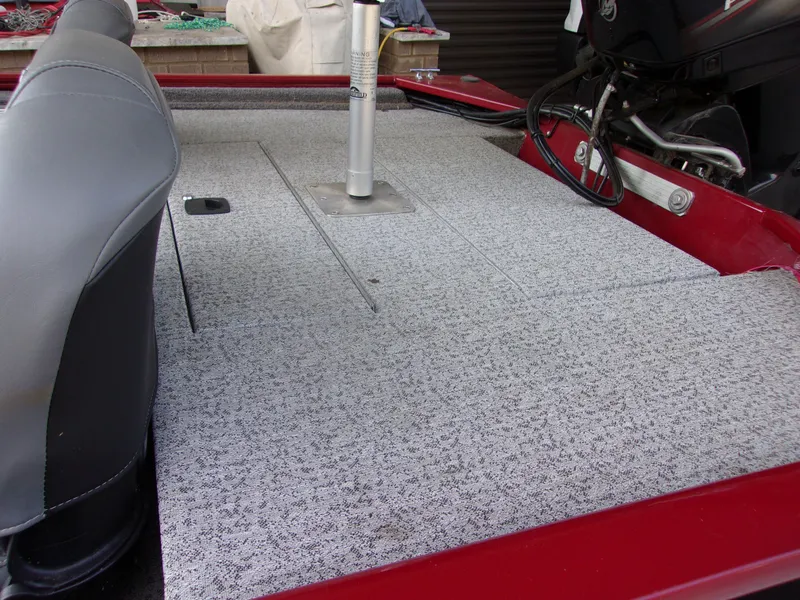 Slide: The Image of 2020 Bass Tracker 160 PRO boat interior with gray carpet and seating. - 4