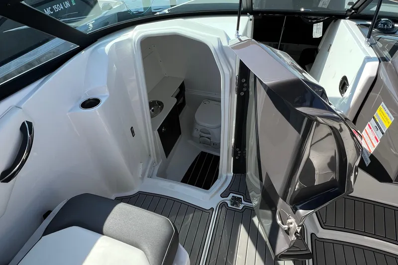 Slide: The Image of 2019 Monterey M6 boat interior with open cabin door and visible seating area. - 9