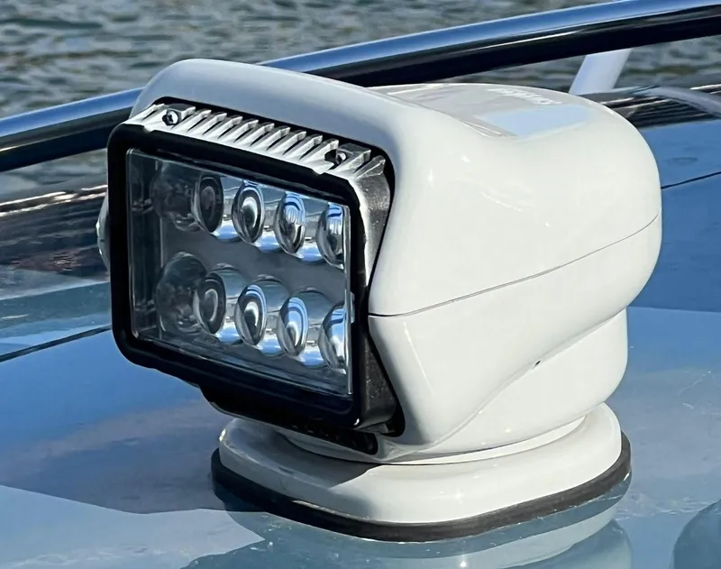 Slide: The Image of Close-up of a spotlight on a 2000 Protector Targa 28 boat. - 25
