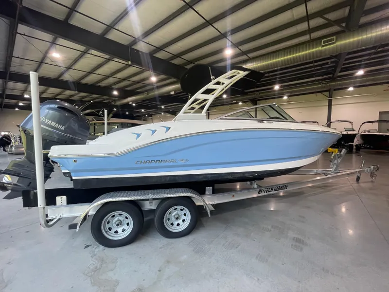 Slide: The Image of 2023 Chaparral 21 SSi OB boat on trailer in indoor showroom. - 12