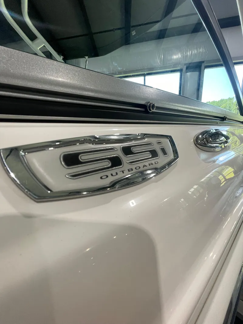 Slide: The Image of 2023 Chaparral 21 SSi OB boat, close-up of SSI Outboard emblem. - 4