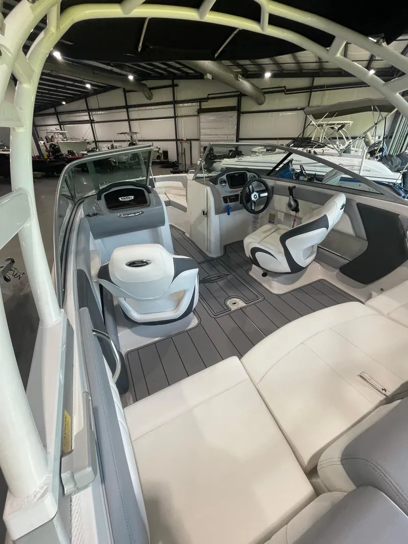 Slide: The Image of 2023 Chaparral 21 SSi OB boat interior with modern seating and steering wheel. - 9